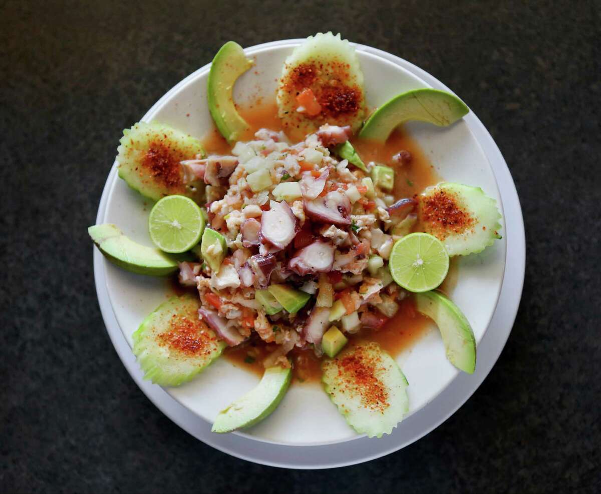 Cucumber, red onion and chile powder go into this shrimp and octopus ceviche.