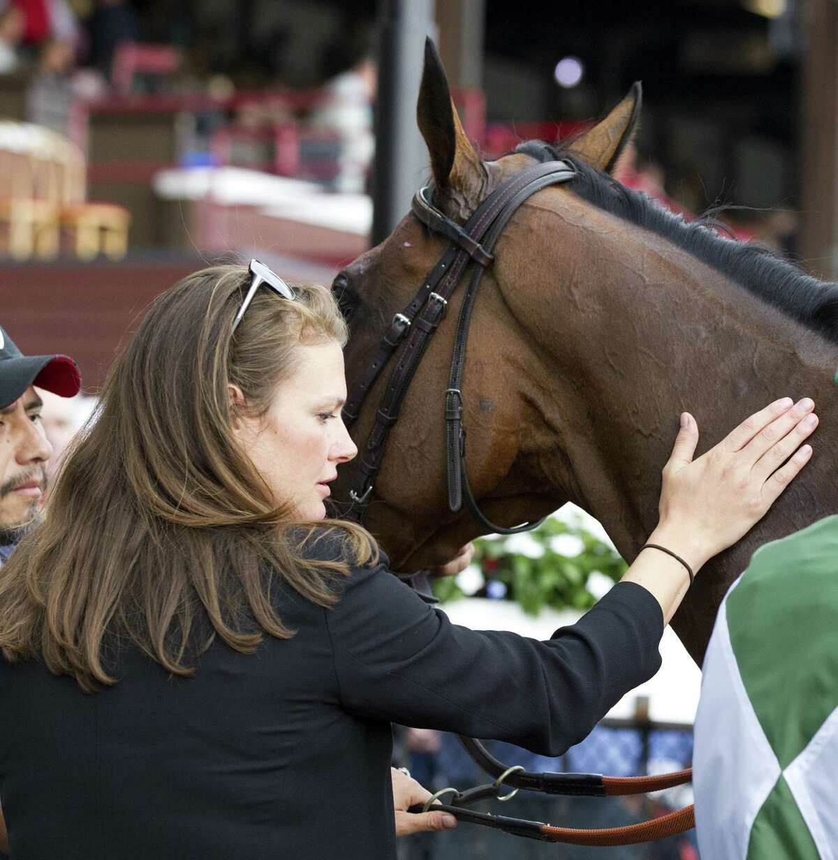 Elizabeth Voss is in the Saratoga winner's circle after Makari, whom Voss trains, won the A.P. Smithwick Memorial Steeplechase Stakes on July 31, 2014, at Saratoga. (Barbara D. Livingston)