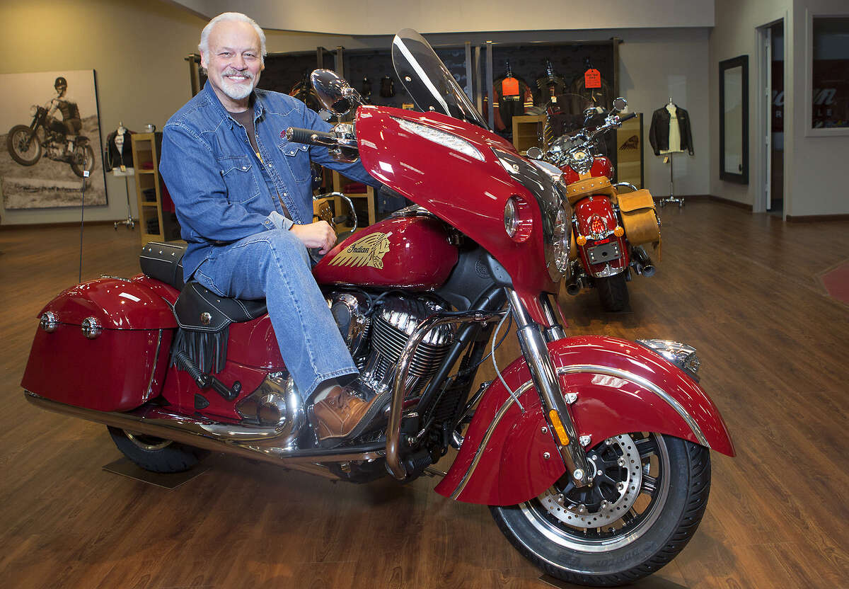 Executive Darrell Harry sits on a 2014 Indian at Team Mancuso Powersports 59, Tuesday, July 29, 2014, in Houston.