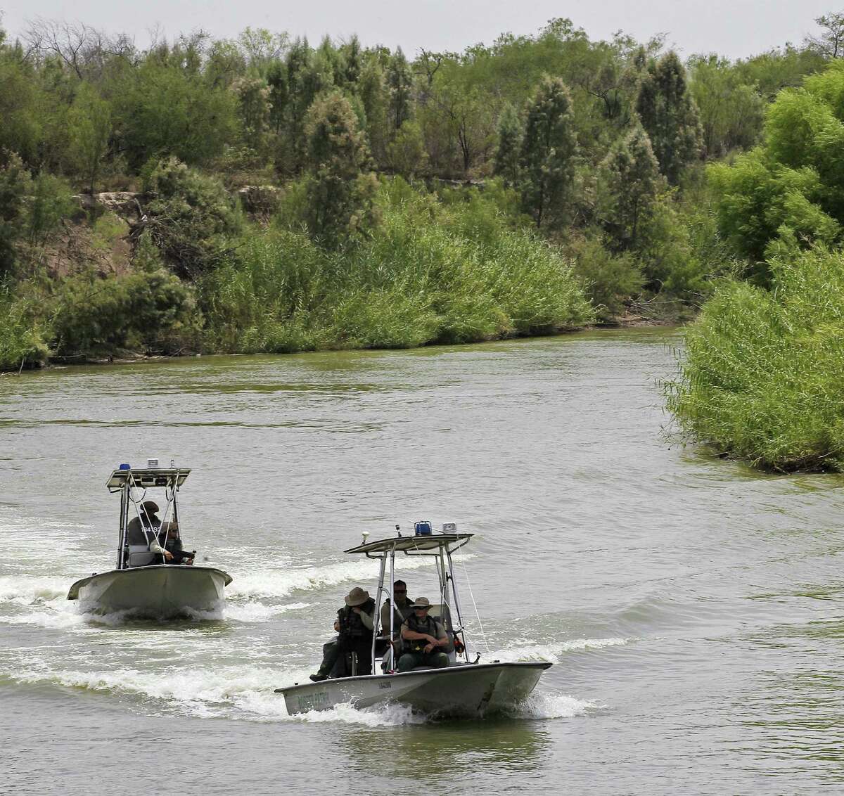 U.S. Border Patrol boats ride the Rio Grande by the McAllen pump in Hidalgo, County, Texas, Thursday, July 24, 2014. It is part of the Rio Grande Sector, an area that has seen an increase of unaccompanied minor Central American immigrants crossing in recent months. According to sector Chief Border Patrol Agent Kevin W. Oaks, his sector currently has 3,234 agents, and 191 support staff. In the past 18 months, they have added 500 new agents, and will add roughly 300 more through the end of this year.