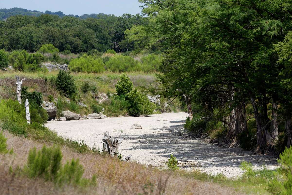 The Guadalupe River has run dry Wednesday Aug. 6, 2014 just down stream from the Rebecca Creek Road bridge crossing. A few miles up stream from the bridge the Spring Branch gauge reported a flow of just .14 cubic feet per second at the 4 p.m. reading.