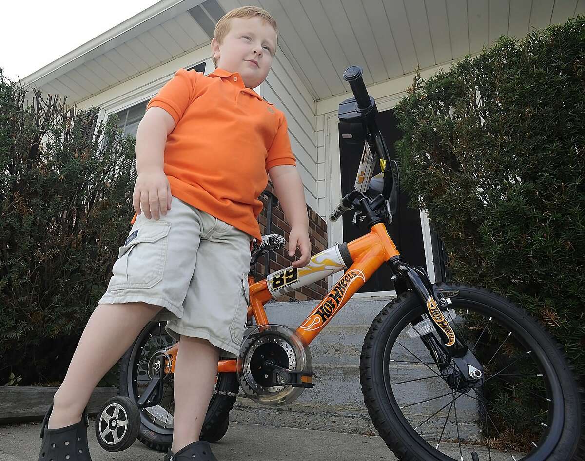 Noah Ritter, 5, poses with his bicycle outside his home in Wilkes-Barre, Pa. on Tuesday, Aug. 5, 2014. His amusing interview on the Scranton, Pa. television station WNEP at the Wayne County Fair in Pennsylvania has gone viral on the Internet. (AP Photo/The Citizens' Voice, Mark Moran)