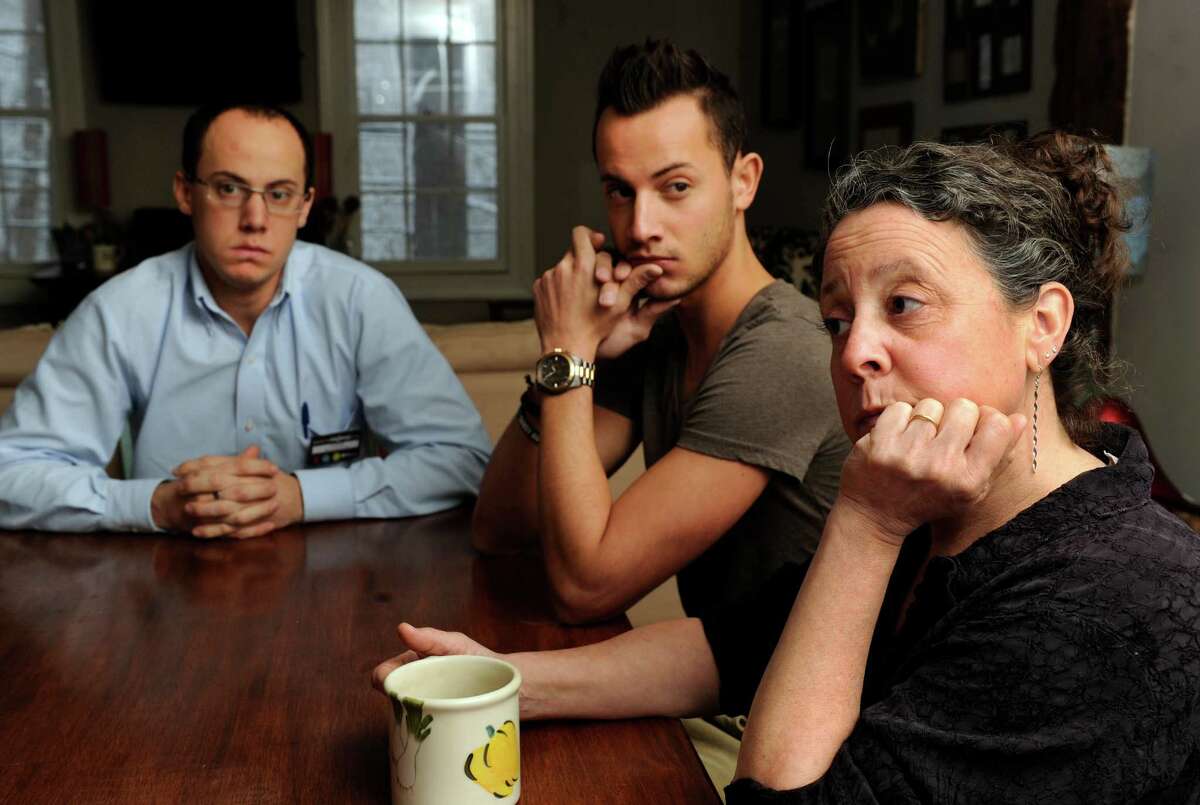 The family of Robert Hoagland, the Sandy Hook man who disappeared July 28, 2013, talks about his disappearance at their Newtown home six months after Robert disappeared. From left to right are two of Robert's sons, Chris and Sam, and his wife, Lori.