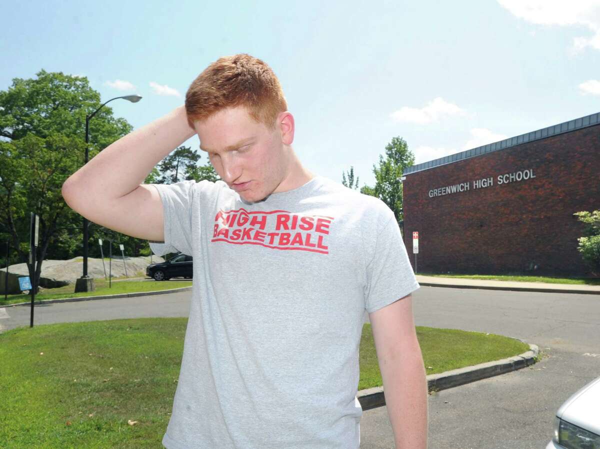 Standing on the campus of Greenwich High School, Conn., Thursday, Aug. 7, 2014, Griffin Golden, 17, who will be a Greenwich High School senior at the start of the upcoming school year, reflects on the death of classmate, Emily Fedorko, who died in a boating accident at Greenwich Point on Wednesday.