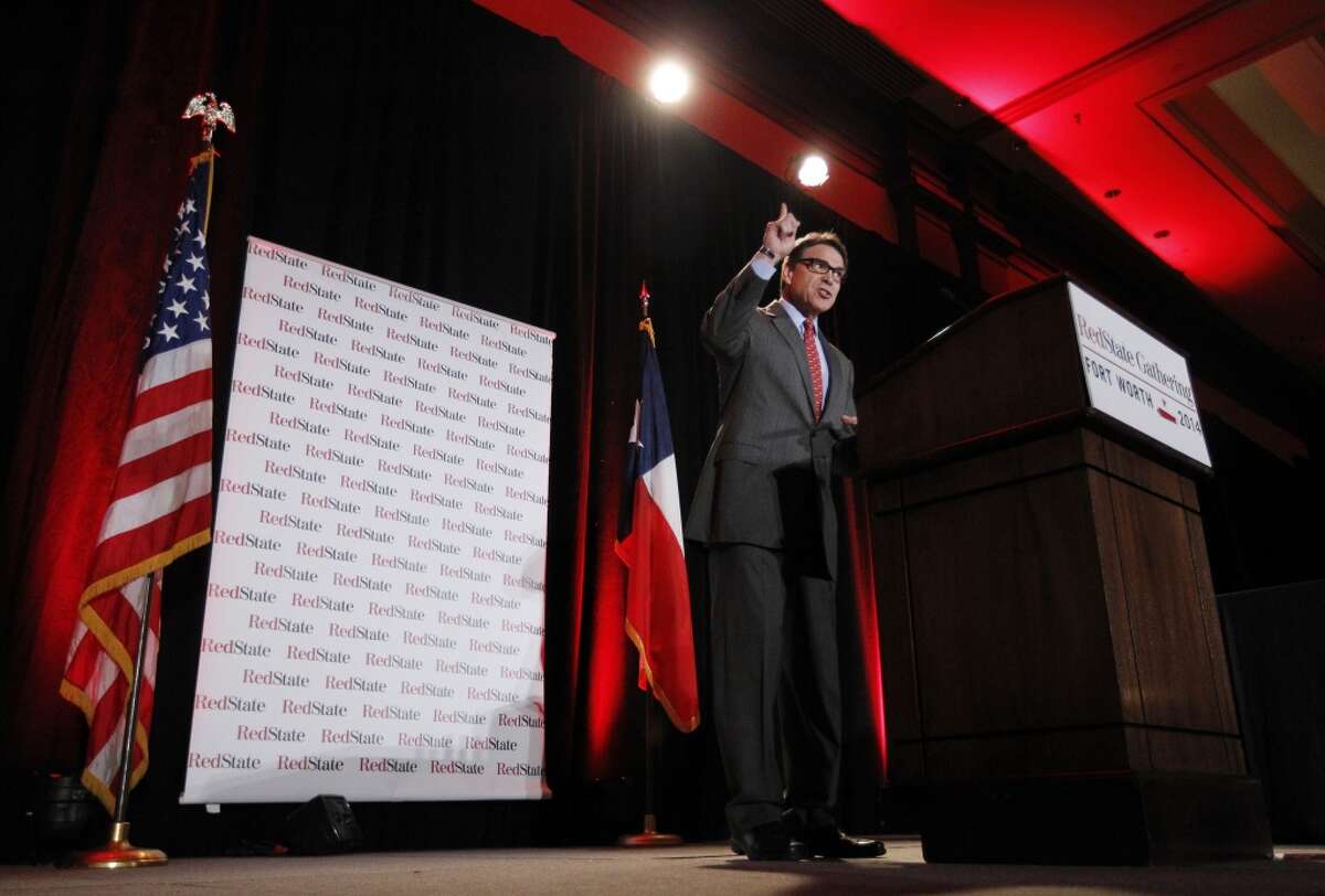 Texas Governor Rick Perry addresses a group of nearly 300 in attendance at the 2014 Red State Gathering, Friday, Aug. 8, 2014, in Fort Worth, Texas. Two Texans eyeing possible 2016 presidential runs, Perry and U.S. Sen. Ted Cruz, are addressing the kind of top-tier conservative event necessary to build national support, the RedState Gathering. (AP Photo/Tony Gutierrez)