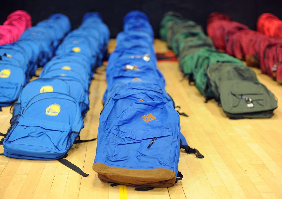 S.F. gives backpacks, kids give smiles
