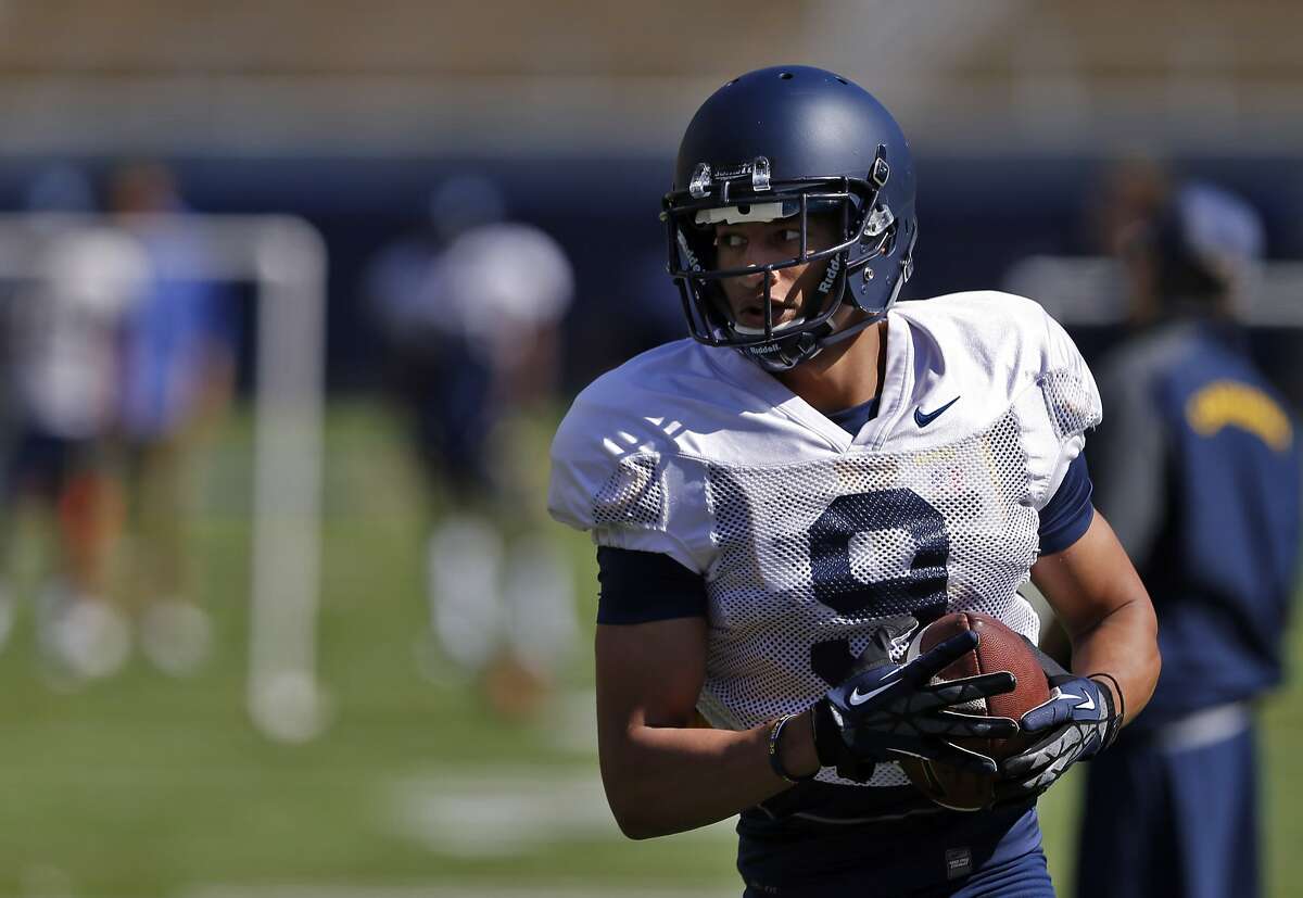 Trevor Davis runs with a ball after catching it during the Cal Football spring practice at Memorial Stadium in Berkeley, Calif., on Wednesday, April 9, 2014.