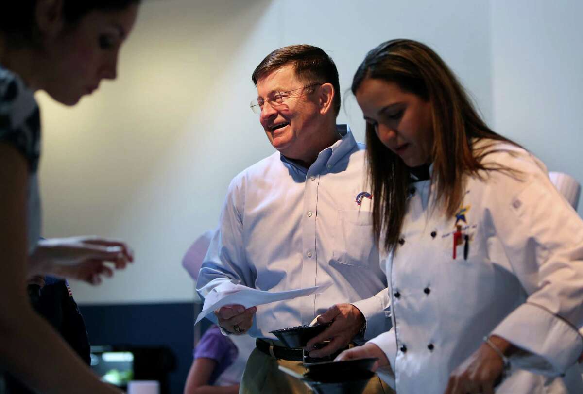 Former Space Shuttle Commander Ken Cameron, second from the left, taste the plates along with other judges at the Mars Food Face-Off at Space City Houston Saturday, Aug. 9, 2014, in Houston, Texas. Contestants, assisted by professional chefs, used authentic ingredients viable for a Mars mission, judged on creativity, presentation, nutritional value and taste. Cameron was aboard three Shuttle missions.