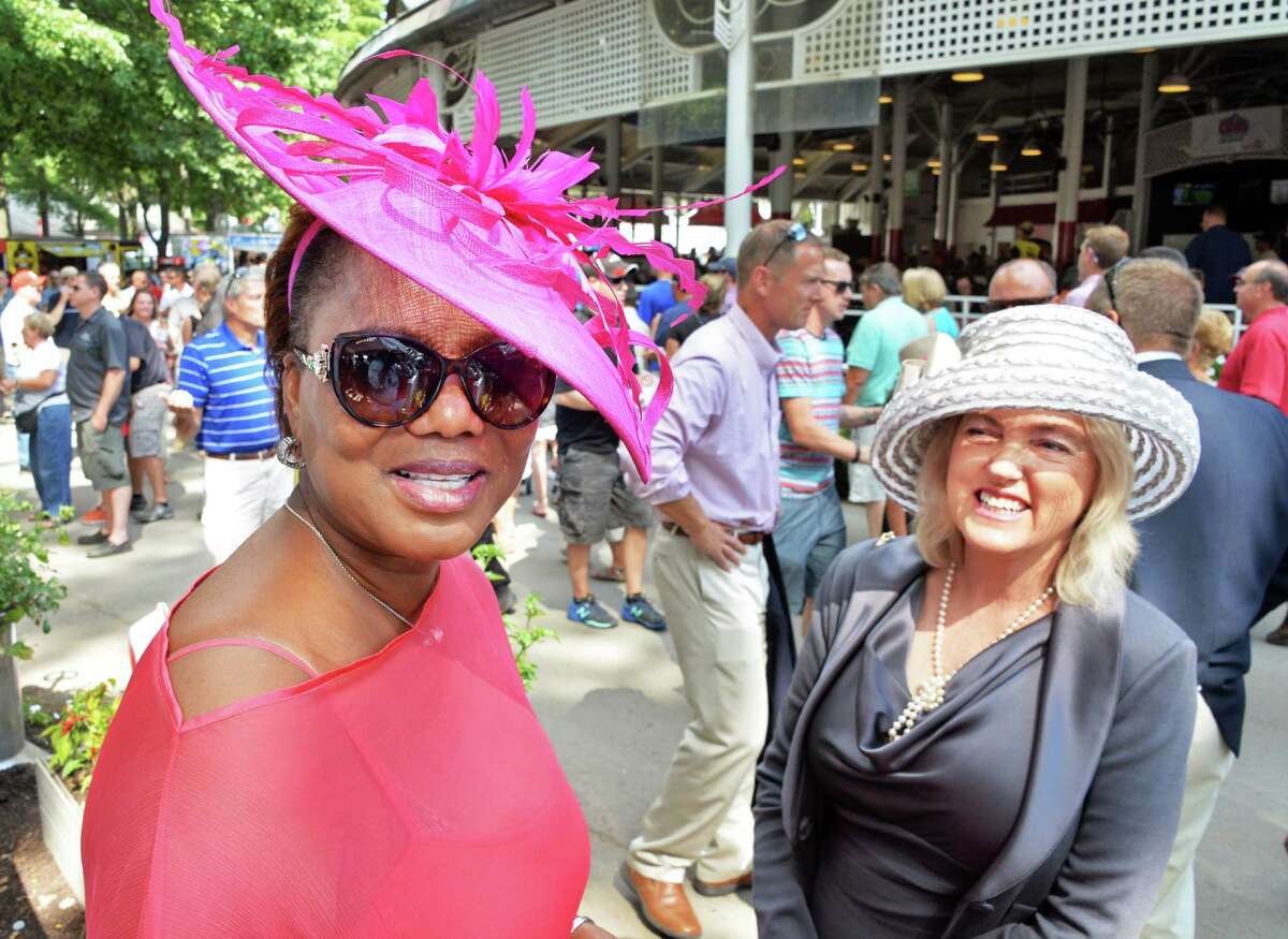 Margot Barnett, left, of Nassau, Bahamas, and Diana Ryan of Saratoga Springs sport perfect examples of a Saratoga hat at Saratoga Race Course Saturday August 9, 2014, in Saratoga Springs, NY. (John Carl D'Annibale / Times Union)
