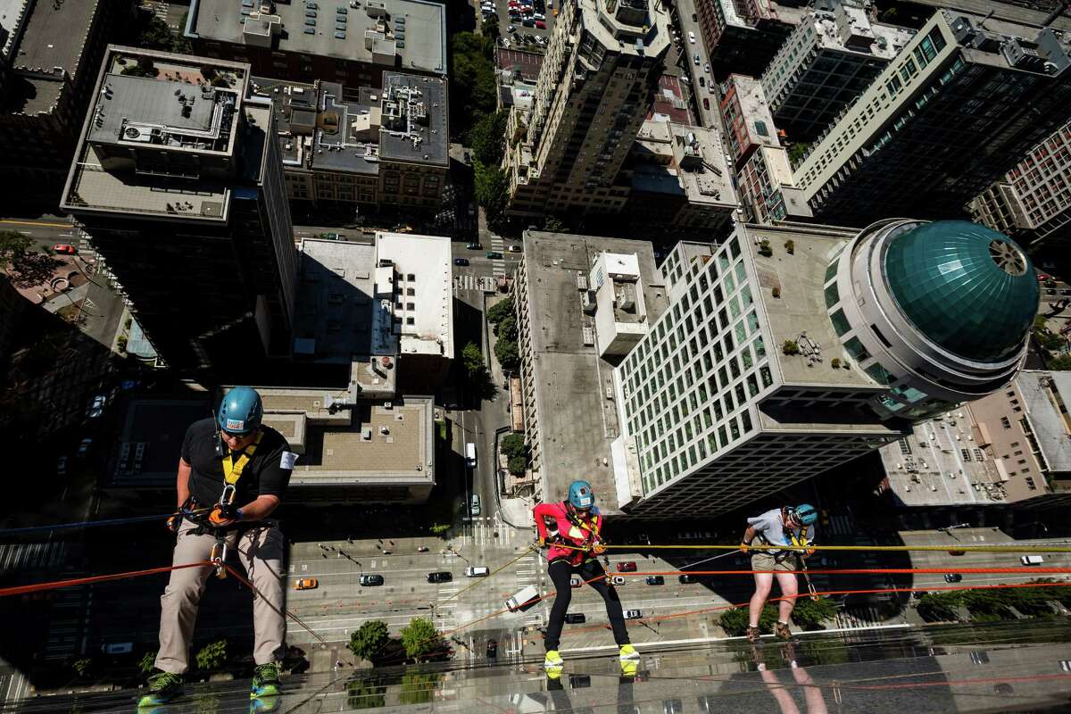 Nearly 100 brave individuals rappelled down the 40 stories and 490 feet of Seattle's 1000 Second Avenue Building as part of the Over The Edge fundraiser to benefit Special Olympics Washington on Saturday, Aug. 9, 2014, in Seattle. Participants are guaranteed a spot as long as they raise a minimum of $1,000 -- the amount it costs to support nearly two Special Olympics athletes for an entire year. The event continues Sunday.