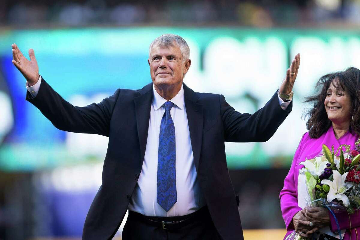 Lou Piniella, alongside his wife, Anita Piniella, right, takes to the field to be honored.
