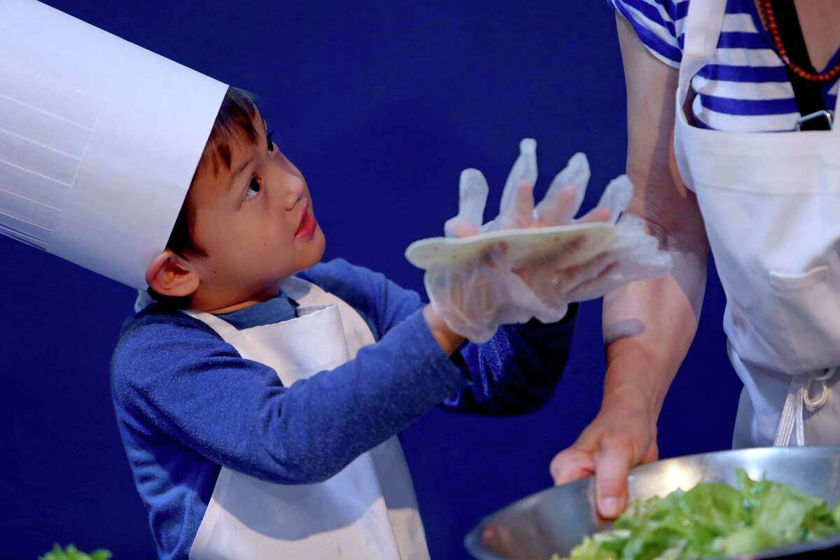 Zane Choi Rigsby, 5, had 30 minutes - and help from Fen Choi - to prepare a Summer Salad for the Mars Food Face-Off at Space City Houston on Saturday, using authentic ingredients viable for a Mars mission, judged on creativity, presentation, nutrition and taste.