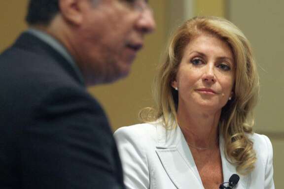 Democratic candidate for governor Sen. Wendy Davis listens as Carlos Sanchez, The Monitor Editor, asks questions during the Newsmakers Breakfast Series at the McAllen Convention Center Thursday, Aug.7, 2014. Davis said Thursday that as governor she would pull Texas National Guard troops from the border if local officials determined they weren't necessary. (AP Photo/The Monitor, Delcia Lopez)