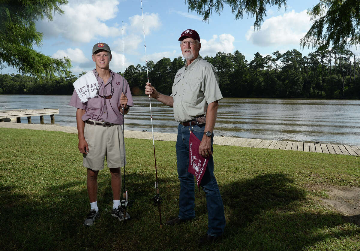 The Beaumont A&M Club will host its 17th annual fishing tournament at Pleasure Island on Saturday. Nick Prewitt and Tom Natho hold their fishing rods at Colliers Ferry Park on Friday. Photo taken Friday, August 08, 2014 Guiseppe Barranco/@spotnewsshooter