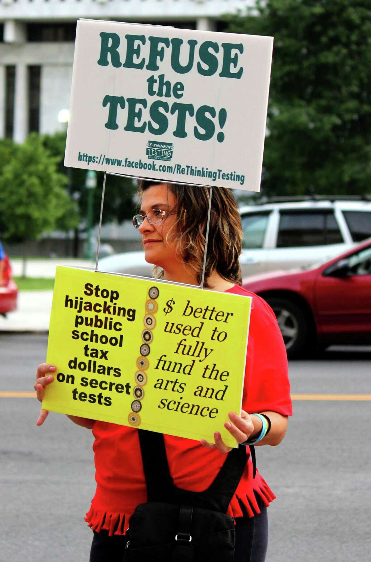 Luz Mooney of Saugerties protests the common core test contracts outside of the NYS Education Department on Monday evening, August 11, 2014, in Albany N.Y. (Selby Smith/Special to the Times Union)