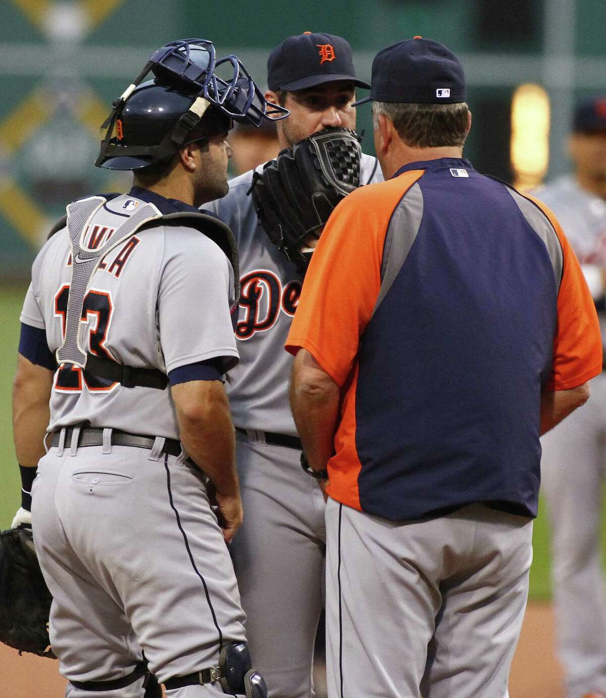 PITTSBURGH, PA - AUGUST 11: Pitcher Justin Verlander #35 of the Detroit Tigers and catcher Alex Avila #13 talk with pitching coach Jeff Jones #51 of the Detroit Tigers in the first inning against the Pittsburgh Pirates during inter-league play at PNC Park on August 11, 2014 in Pittsburgh, Pennsylvania.