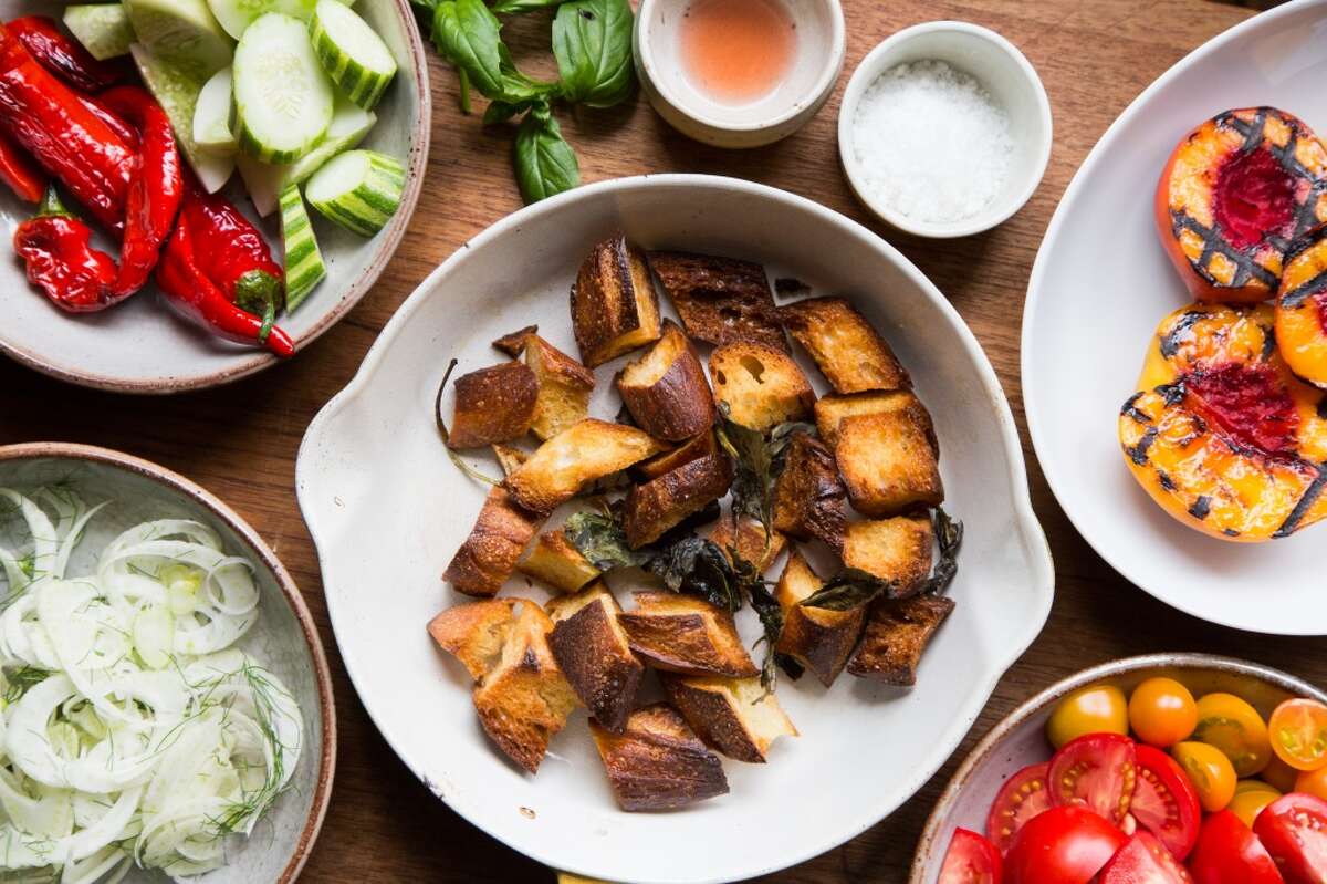 Melissa Perello, chef at Frances restaurant, uses a variety of ingredients for a panzanella salad including toasted levain bread, grilled stone fruit, fennel, tomatoes, peppers and cucumbers at her home in San Francisco.