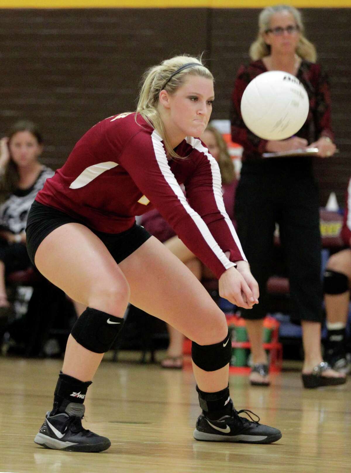 Deer Park's Maddie Wallace digs a ball during a high school volleyball game against Clear Falls on Tuesday, Aug. 12, 2014, in Deer Park.