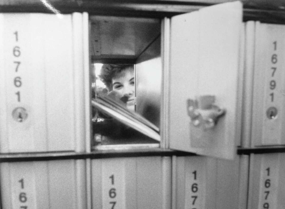 The U.S. Postal Service delivered on a promise to open a new North Stamford substation at Turn of River Hardware. Pictured here, Robin Lord fills a post office box on Aug. 22, 1989.