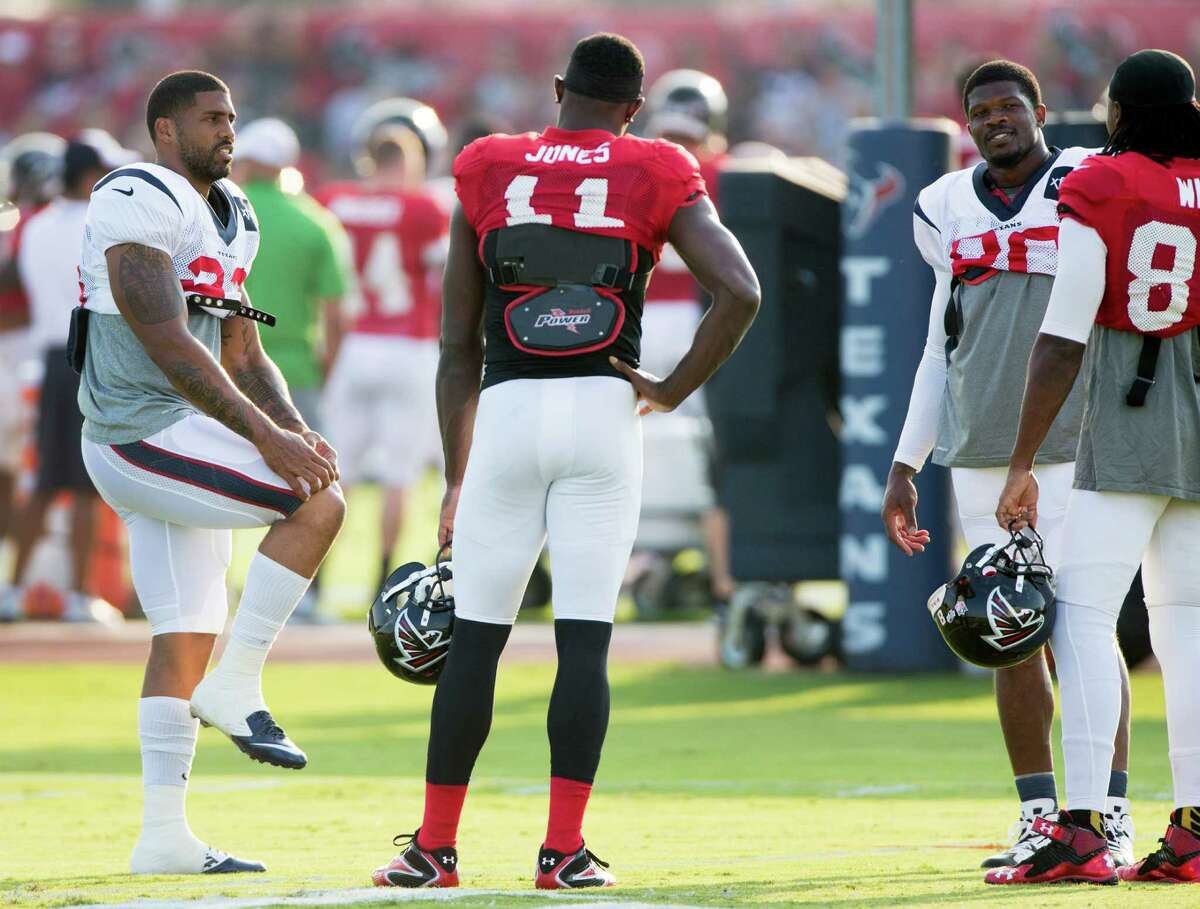With the return to practice of running back Arian Foster, left, and wide receiver Andre Johnson, second from right, the Texans brought back the star power Wednesday when they hosted Julio Jones (11) and his Falcons teammates at the Methodist Training Center.