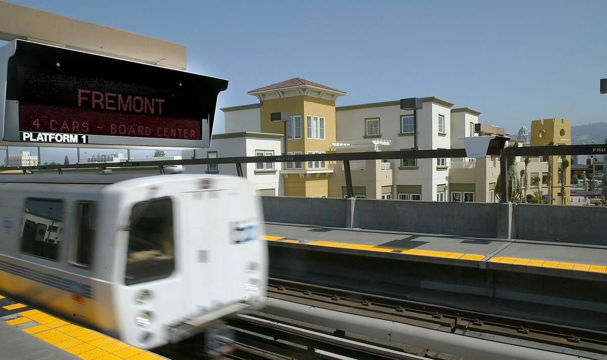 A BART train pulls into the Fruitvale station. Fruitvale Village is right outside the front doors of the station. SB827 would override local density and height limits on apartments and condo buildings up to five stories high if the projects are within a half-mile of major transit hubs.