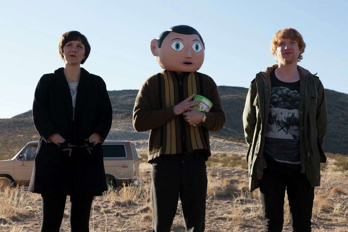 Maggie Gyllenhaal, from left, Michael Fassbender and Domhnall Gleeson star as members of a band in "Frank."