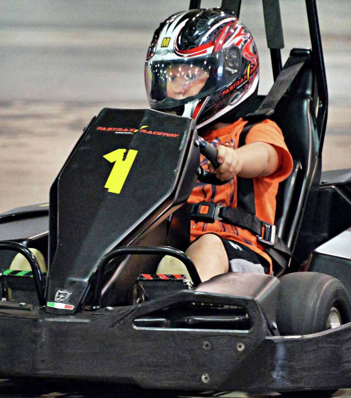 Nine-year-old Cameron Bee of Voorheesville races a go-cart at FasTrax Raceway in Crossgates Commons Tuesday July 29, 2014, in Albany, NY. (John Carl D'Annibale / Times Union)