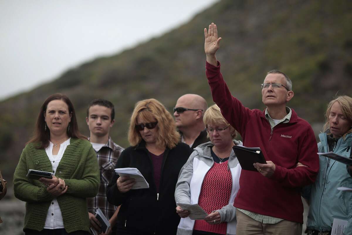 Lindsay Cutshall's father Chris prays at Goat Rock Beach on Friday, Aug. 14, 2014 in Jenner, Calif. Lindsay and her fiance were killed in Jenner ten years ago.