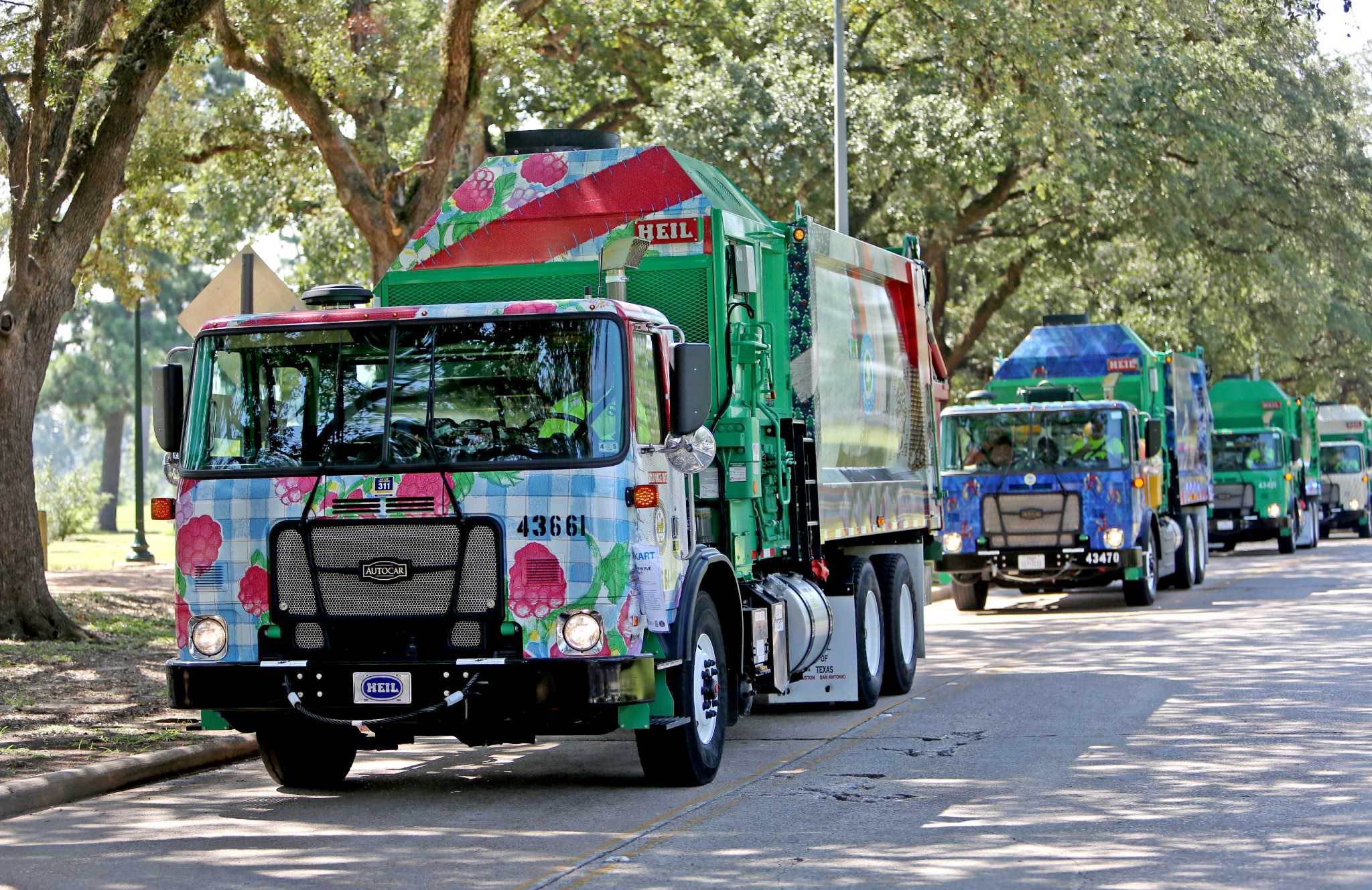 City rolls out art-covered recycling trucks