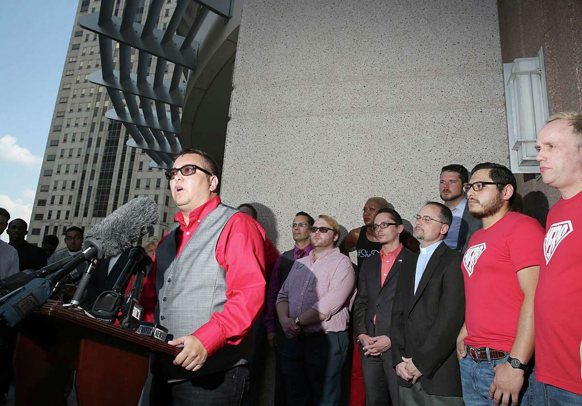 Lou Weaver gives his views in support of the city's Equal Rights Ordinance during Friday's rally on Caroline. Opponents of the measure won the right to an "expedited" trial set for January 2015