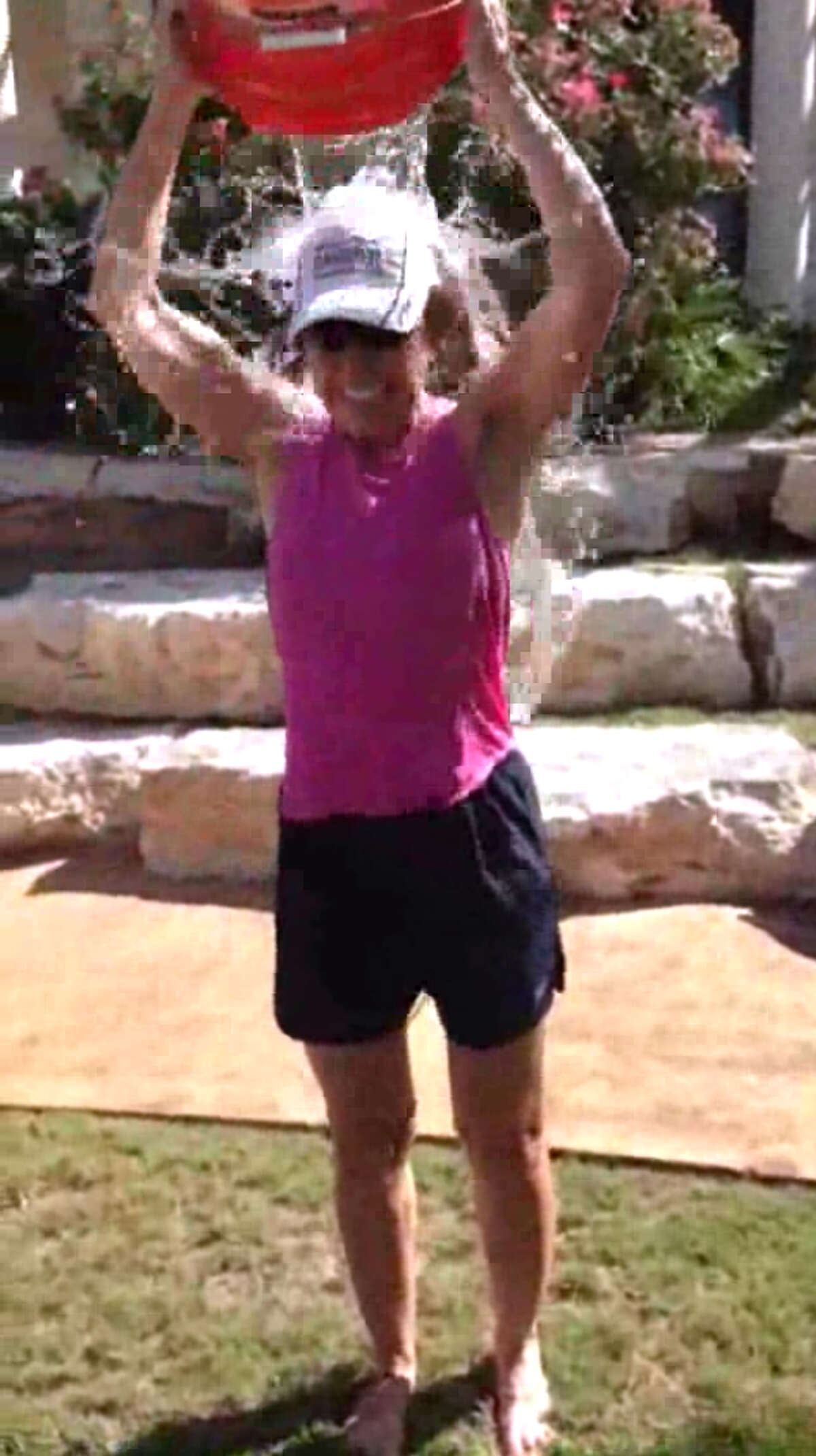 San Antonio City Manager Sheryl Sculley takes the ALS ice bucket challenge, albeit with a minimal amount of water, Saturday morning, Aug. 16, 2014.