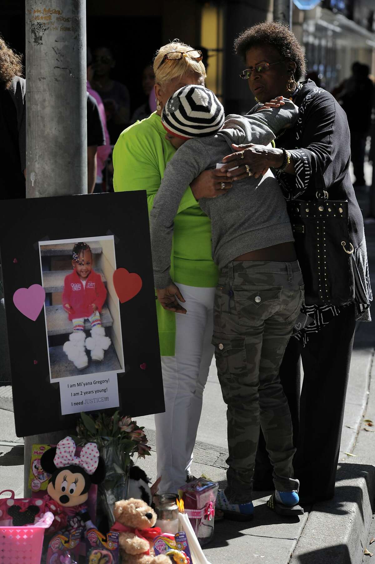 Shonece Rodgers, 20, breaks down and is comforted by her grandmother in-law Cynthia Johnson, left, during a vigil for her daughter Mi-Yana Gregory on August 17, 2014 in San Francisco, CA. Mi-Yana Gregory, 2, was killed by a hit-and-run driver Friday night on Mission Street in downtown. The vigil took place on Mission street at the crosswalk between 4th and 5th where Mi-Yana was struck.