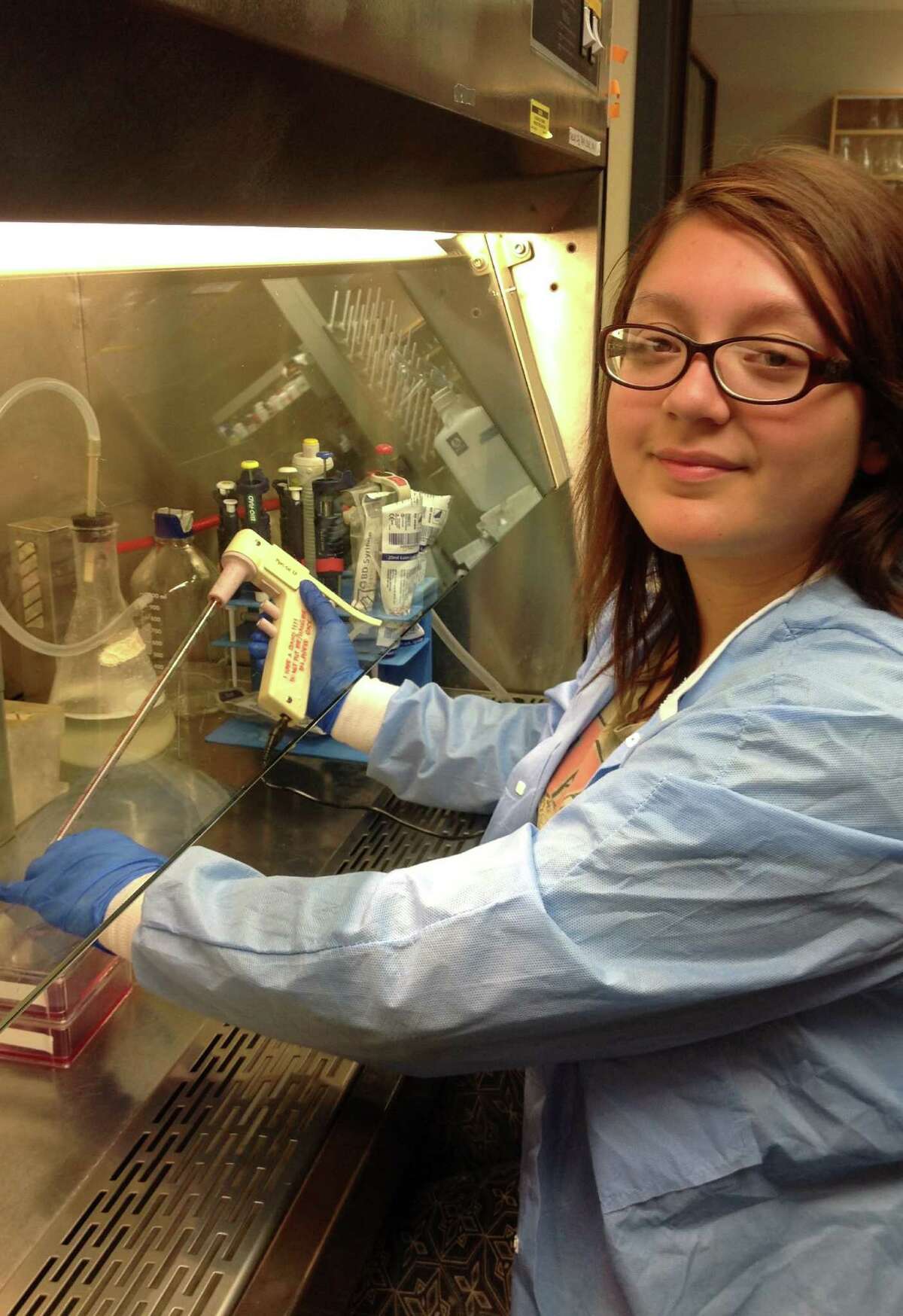 Diana Godoy, a student at Palo Alto College, works in the biochemistry laboratory of Andrew Tsin at UTSA.