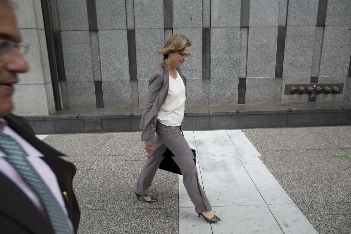 San Bruno City Manager Connie Jackson walks away with senior adviser Craig Bettencourt, left, after addressing media about the PG&E case regarding an array of felony charges connected with a fatal natural gas explosion in San Bruno at the federal courthouse in San Francisco, Calif. on Monday, August 18, 2014. PG&E pleaded not guilty.
