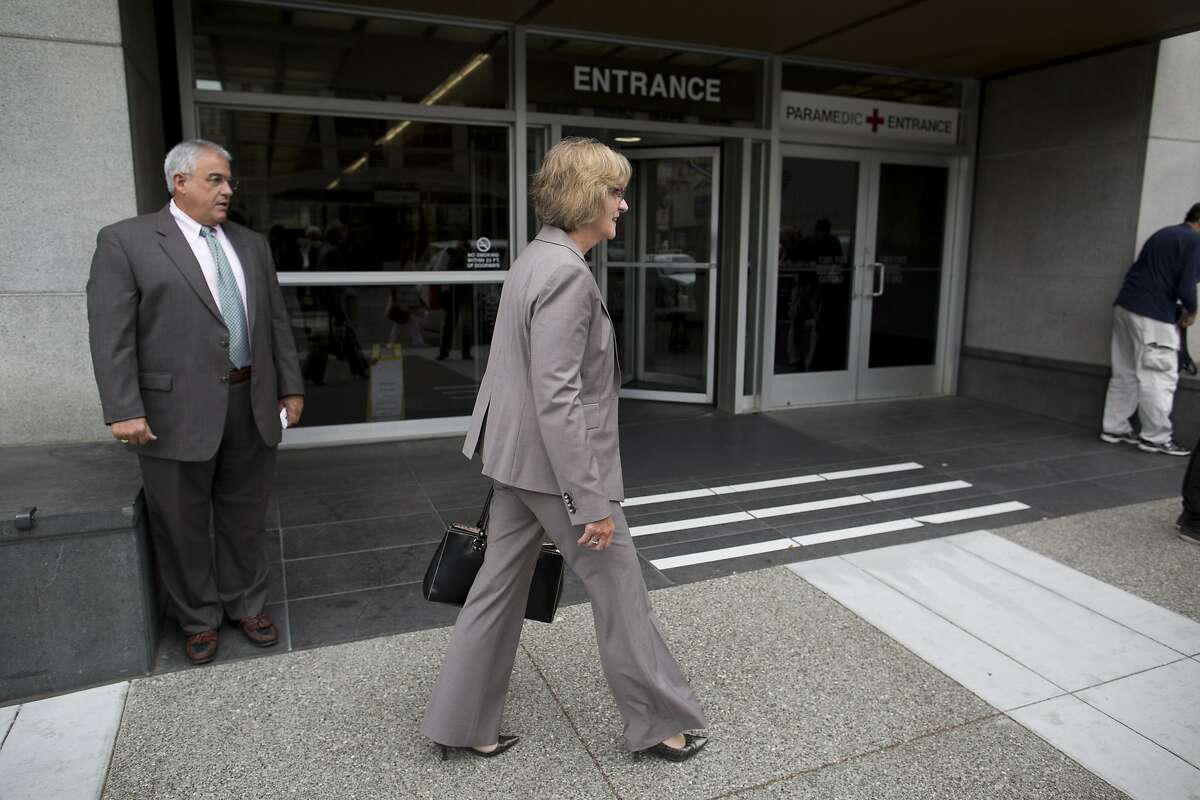 San Bruno City Manager Connie Jackson walks away with senior adviser Craig Bettencourt, left, after addressing media about the PG&E case regarding an array of felony charges connected with a fatal natural gas explosion in San Bruno at the federal courthouse in San Francisco, Calif. on Monday, August 18, 2014. PG&E pleaded not guilty.