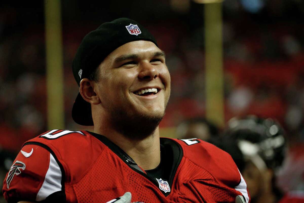 Atlanta Falcons offensive tackle Jake Matthews (70) stands on the sidelines against the Miami Dolphins during the second half of an NFL preseason football game, Friday, Aug. 8, 2014, in Atlanta. (AP Photo/John Bazemore)