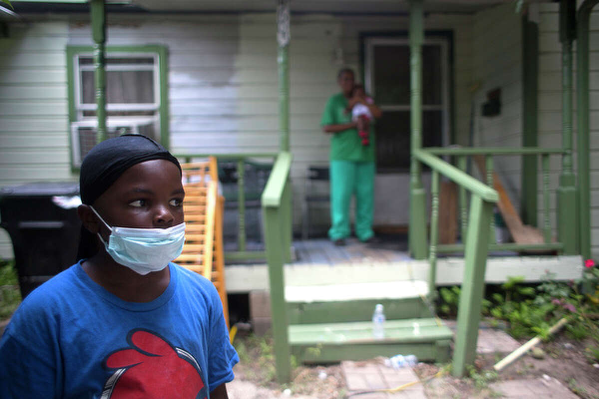 Daymon Thomas stands in his front yard last year where his grandmother was holding his infant sister. The family was among residents to rally for more cleanup after recent chemical leakage from the now defunct Houston-based waste management company CES Environmental Services.
