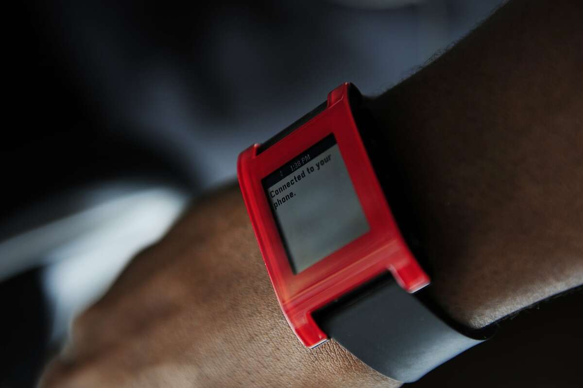Jibril Jaha's watch which displays text from anyone who speaks into his phone is seen on August 18, 2014 in San Francisco, CA. Jaha, who is deaf, has created an application called "I see what you say", which allows users to speak into his phone so that their words will be transmitted into text on his watch. Jaha moved to the Bay Area to co-found the company behind the app, and drives for Lyft both to make money and as a way of testing out the app.