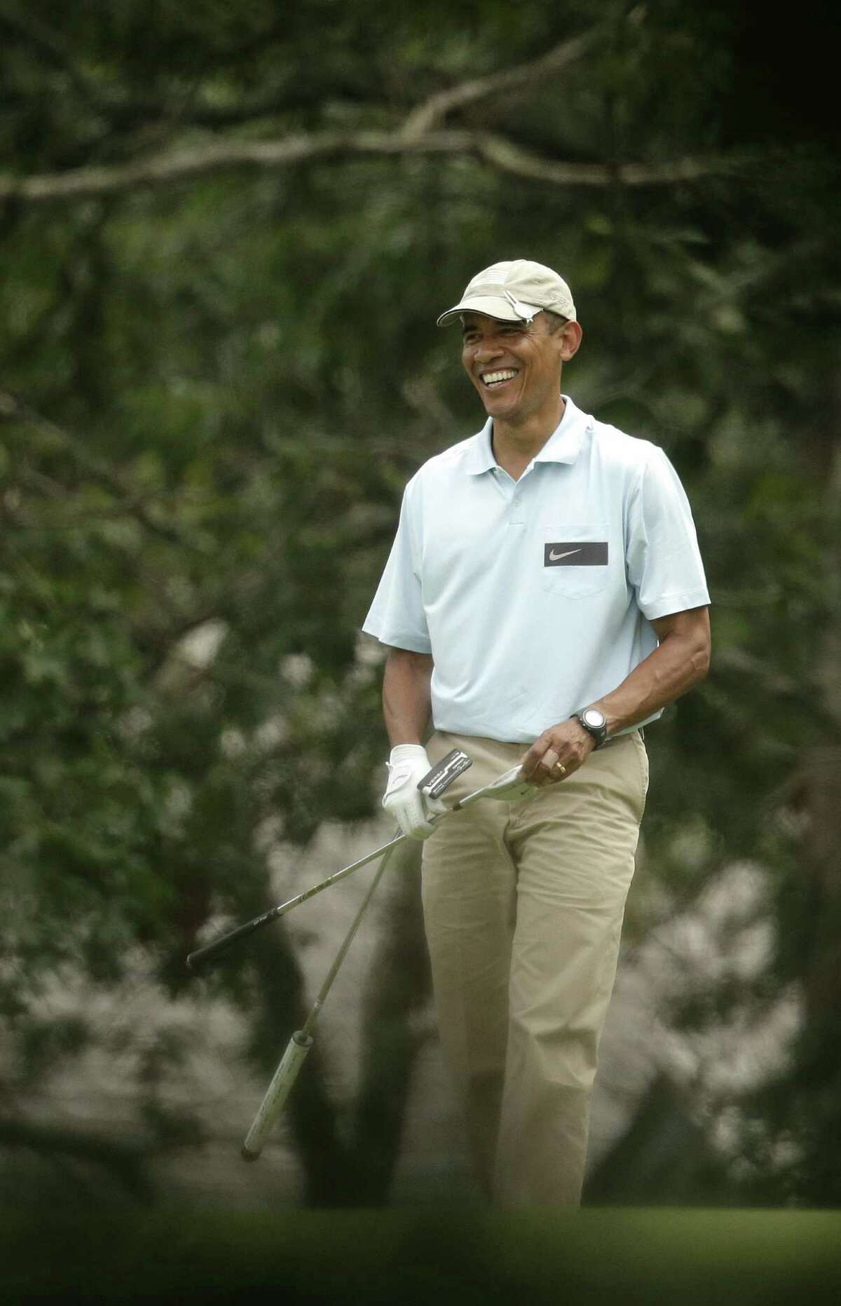 President Barack Obama enjoys a round of golf at Martha's Vineyard, Mass. As crises engulf the globe, a reader calls the president an absentee landlord of the White House whose chief function is fundraising.
