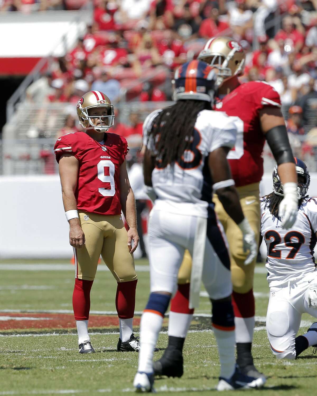 Phil Dawson (9) watches as he misses his second field goal attempt in the first half as the 49ers play the Denver Broncos in the first preseason game at Levi's Stadium in Santa Clara, Calif., on Sunday, August 17, 2014.