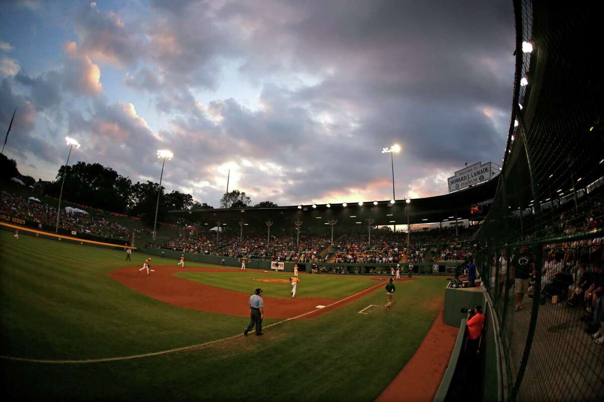 The sunsets over Lamade Stadium during an elimination baseball game between Chicago and Pearland at the Little League World Series tournament in South Williamsport, Pa., Tuesday, Aug. 19, 2014. Chicago won 6-1. (AP Photo/Gene J. Puskar)