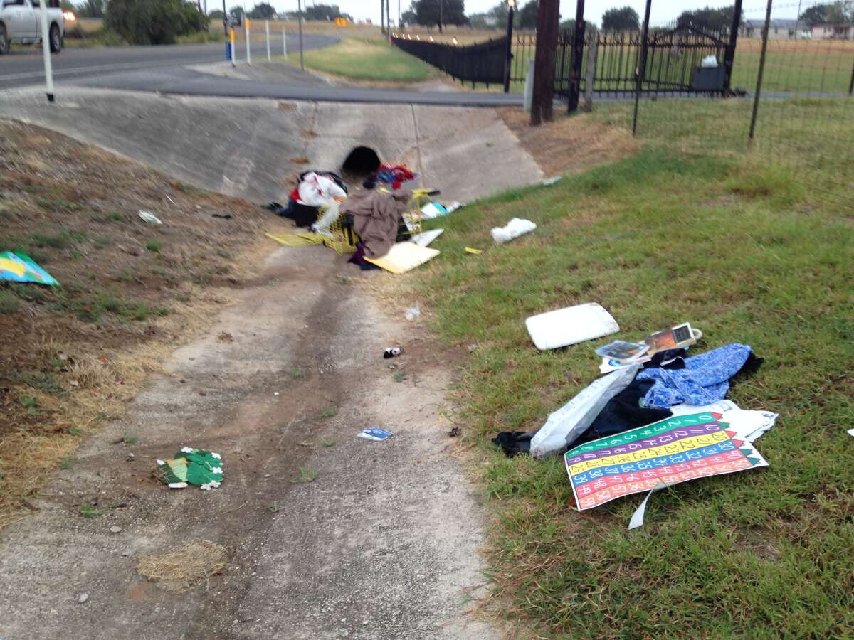 Woman pushing cart on road hit by pickup