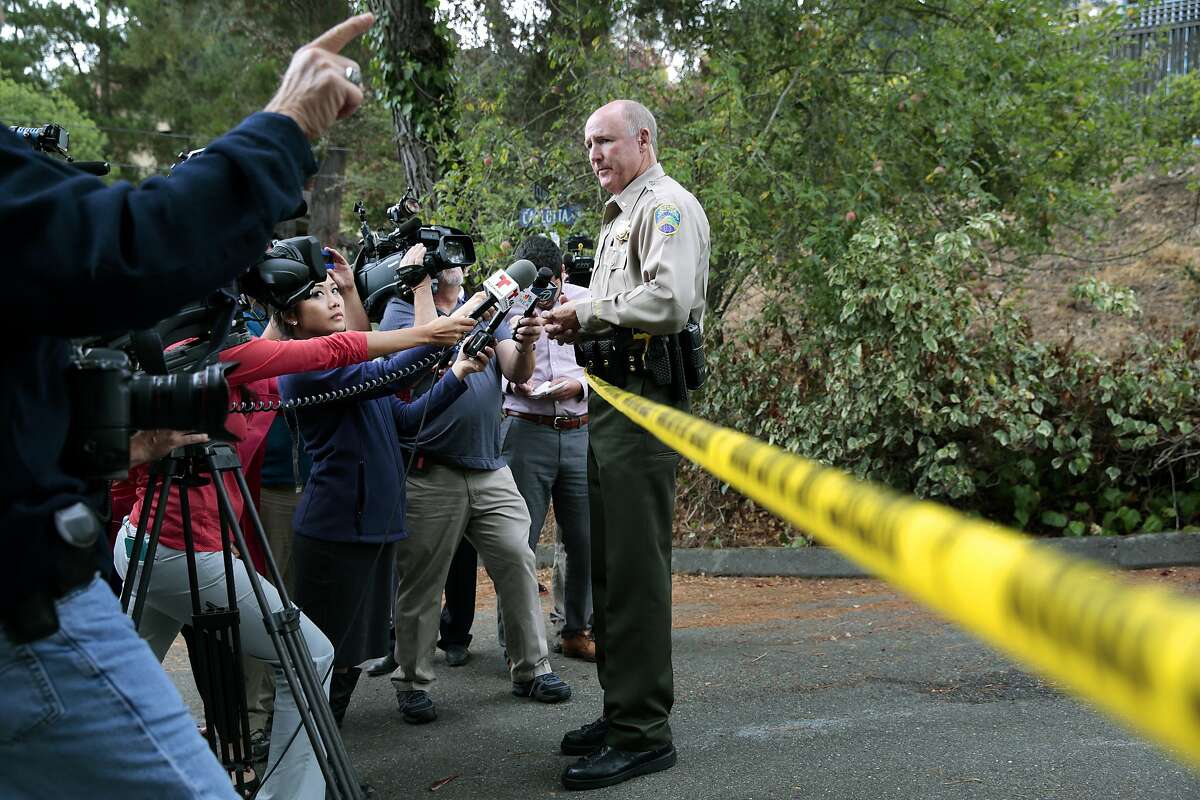 Marin County sheriff's Lt. Doug Pittman briefs reporters on the probe into the rare Marin County slayings.