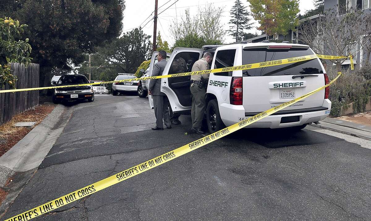 Marin County Sheriff's detectives investigate the shooting deaths of two men in neighboring backyards on Carlota Circle in the Strawberry neighborhood of Mill Valley, Calif., Thursday, Aug. 21, 2014.