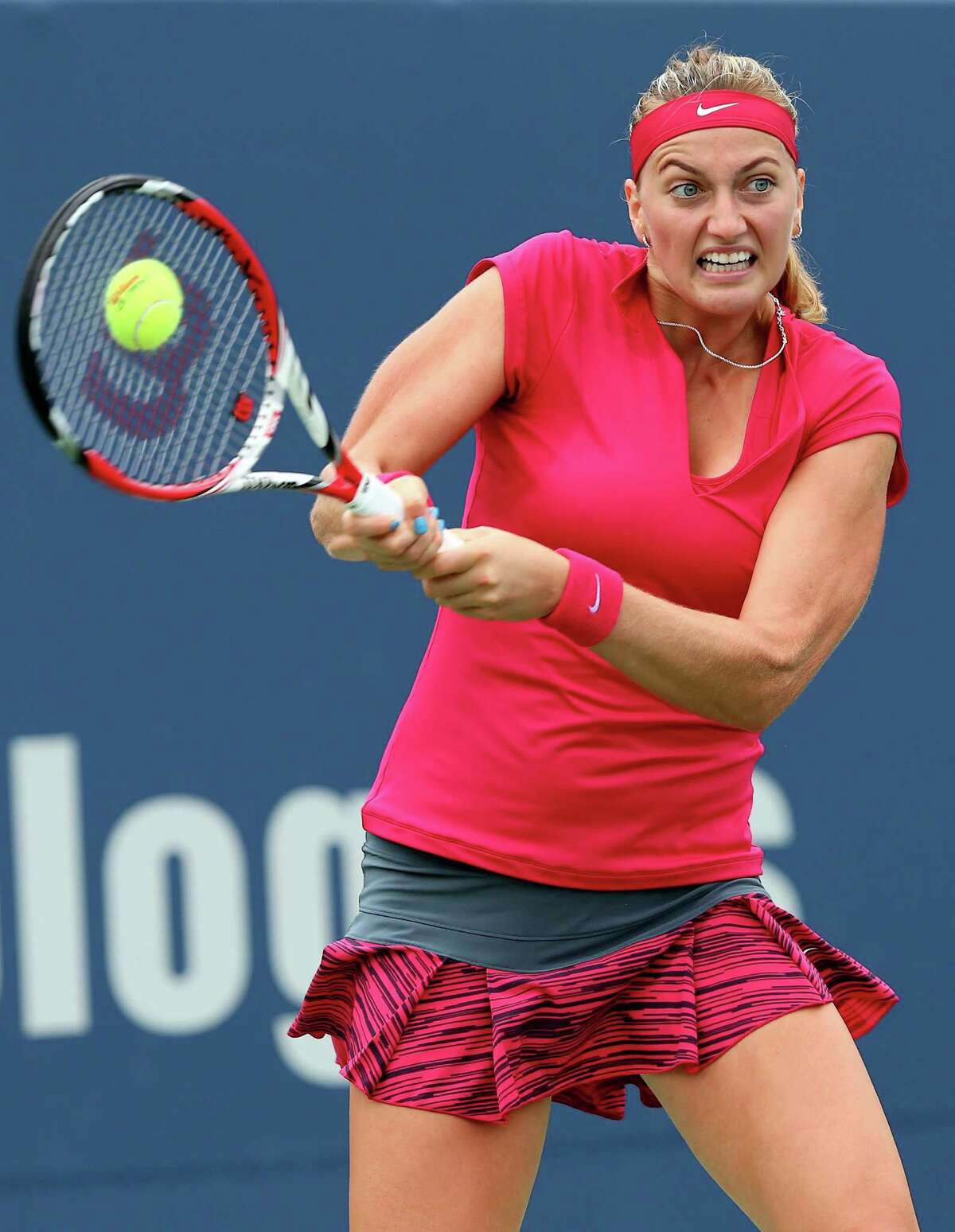 NEW HAVEN, CT - AUGUST 21: Petra Kvitova of the Czech Republic returns a shot to Barbora Zhlavova Strycova of the Czech Republic during the Connecticut Open at the Connecticut Tennis Center at Yale on August 21, 2014 in New Haven, Connecticut.