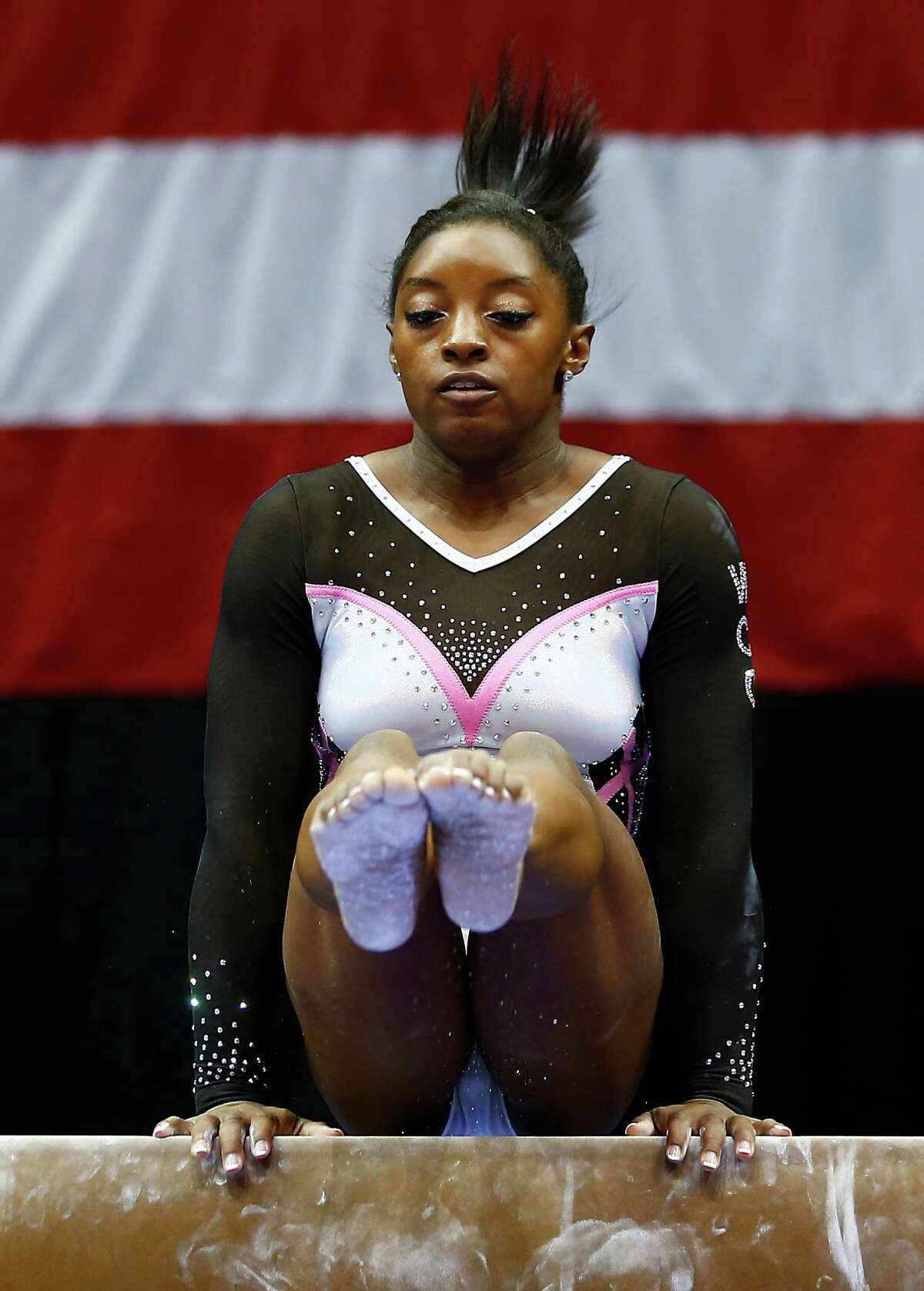 PITTSBURGH, PA - AUGUST 21: Simone Biles competes on the balance beam section of the senior women preliminaries during the 2014 P&G Gymnastics Championships at Consol Energy Center on August 21, 2014 in Pittsburgh, Pennsylvania.