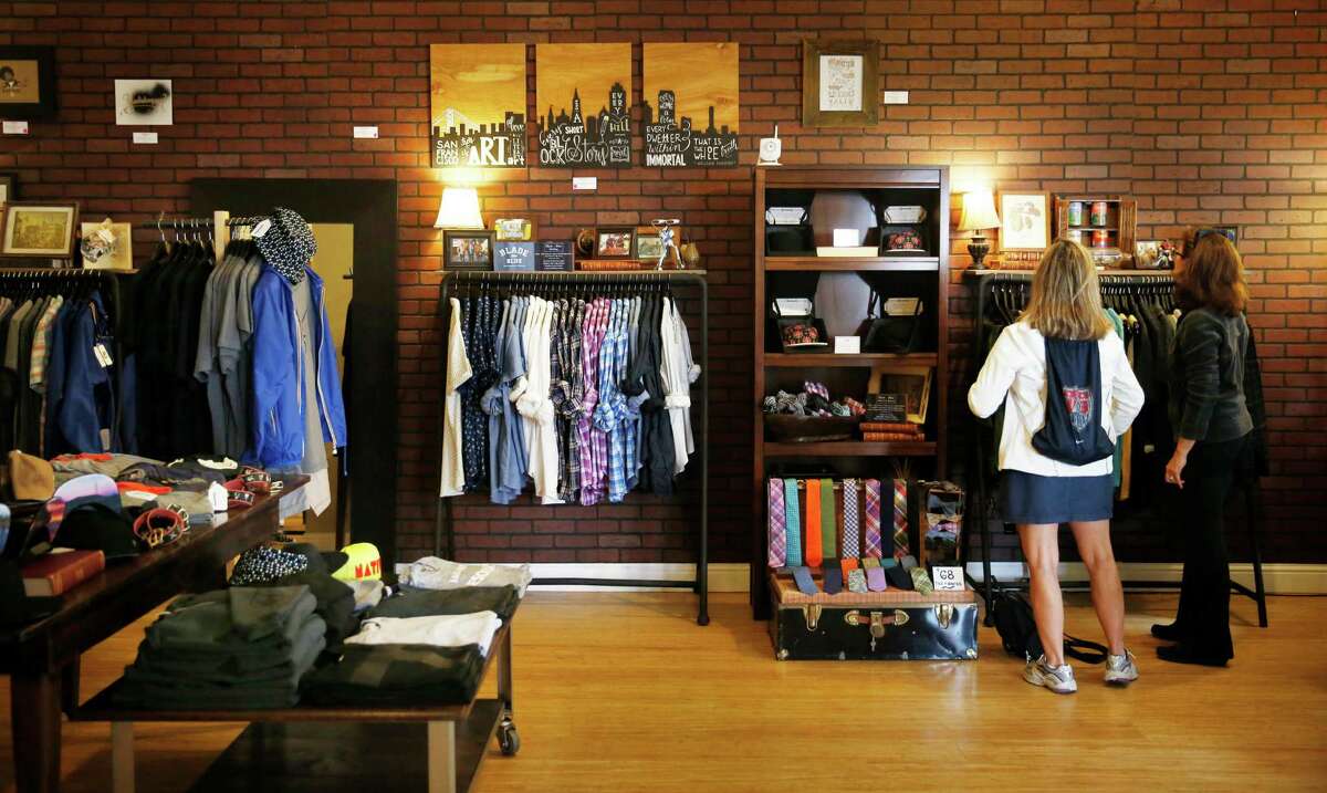 Shoppers looks through clothes while shopping at Asmbly Hall on Wednesday, August 13, 2014 in San Francisco, Calif.