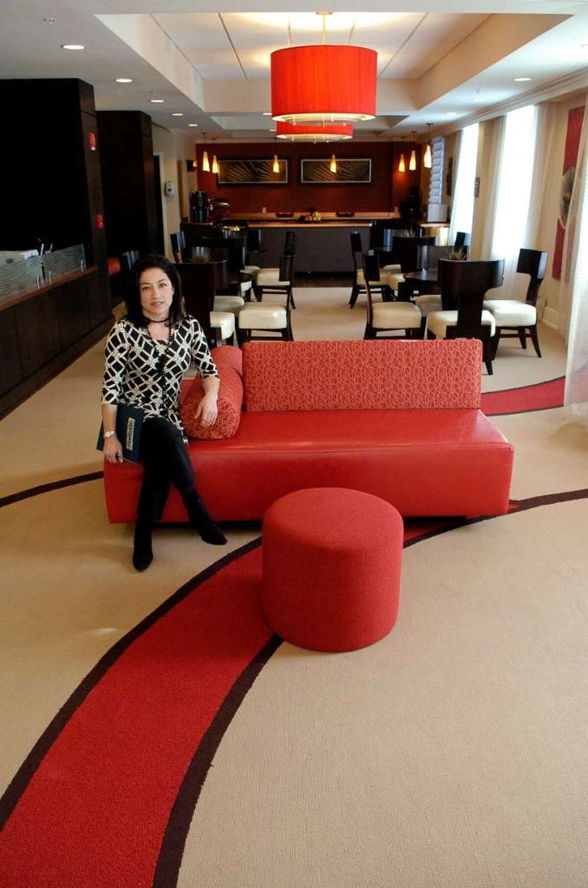 Mia Schipani, director of business development at Hotel Zero Degrees in Stamford, Conn., sits in the lobby of the hotel on Thursday February 18, 2010.