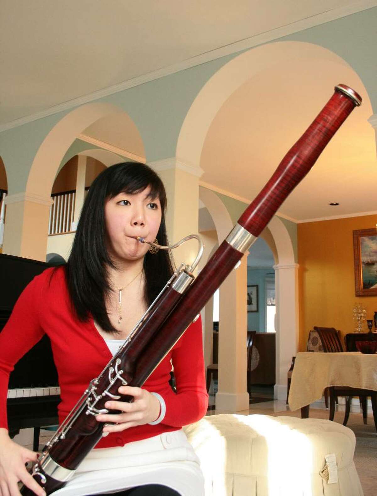 Catherine Chen, a senior at Greenwich High School shown practicing on the bassoon, will compete in the final round of "The President's Own" U.S. Marine Band's Concerto Competition today in Washington, D.C.