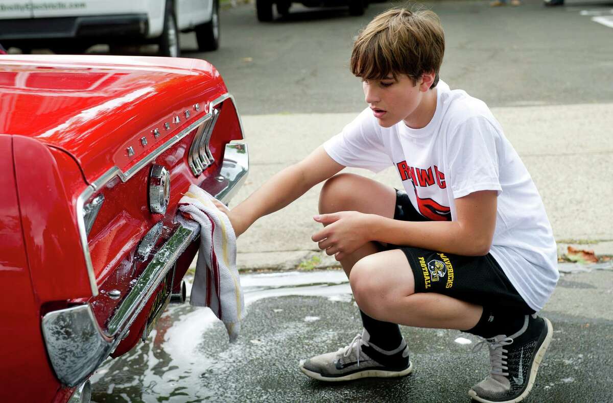 GHS football players hold car wash